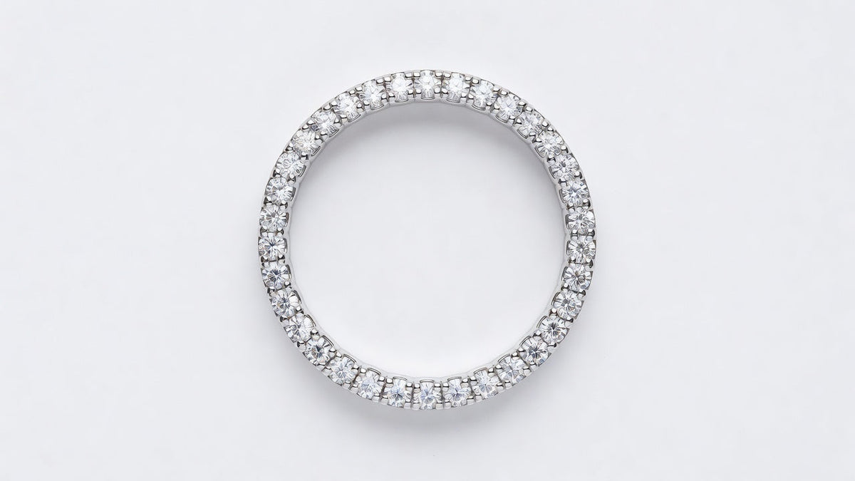 A moissanite eternity band photographed from directly above showing stones set continuously around the entire circle