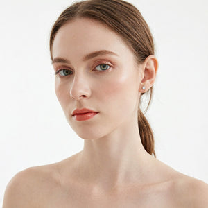 Model wearing Moissanite Stud Earrings natural everyday look white background | Oglowa